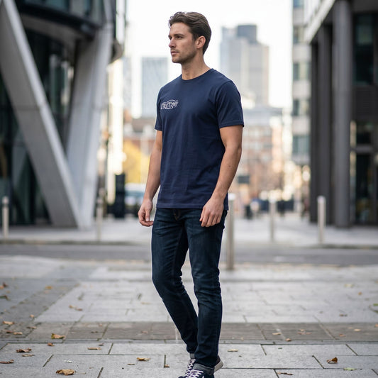 Full-body view of the CLUTCHO Tshirt - Shift worn by a model in an urban environment highlighting relaxed fit and natural drape.